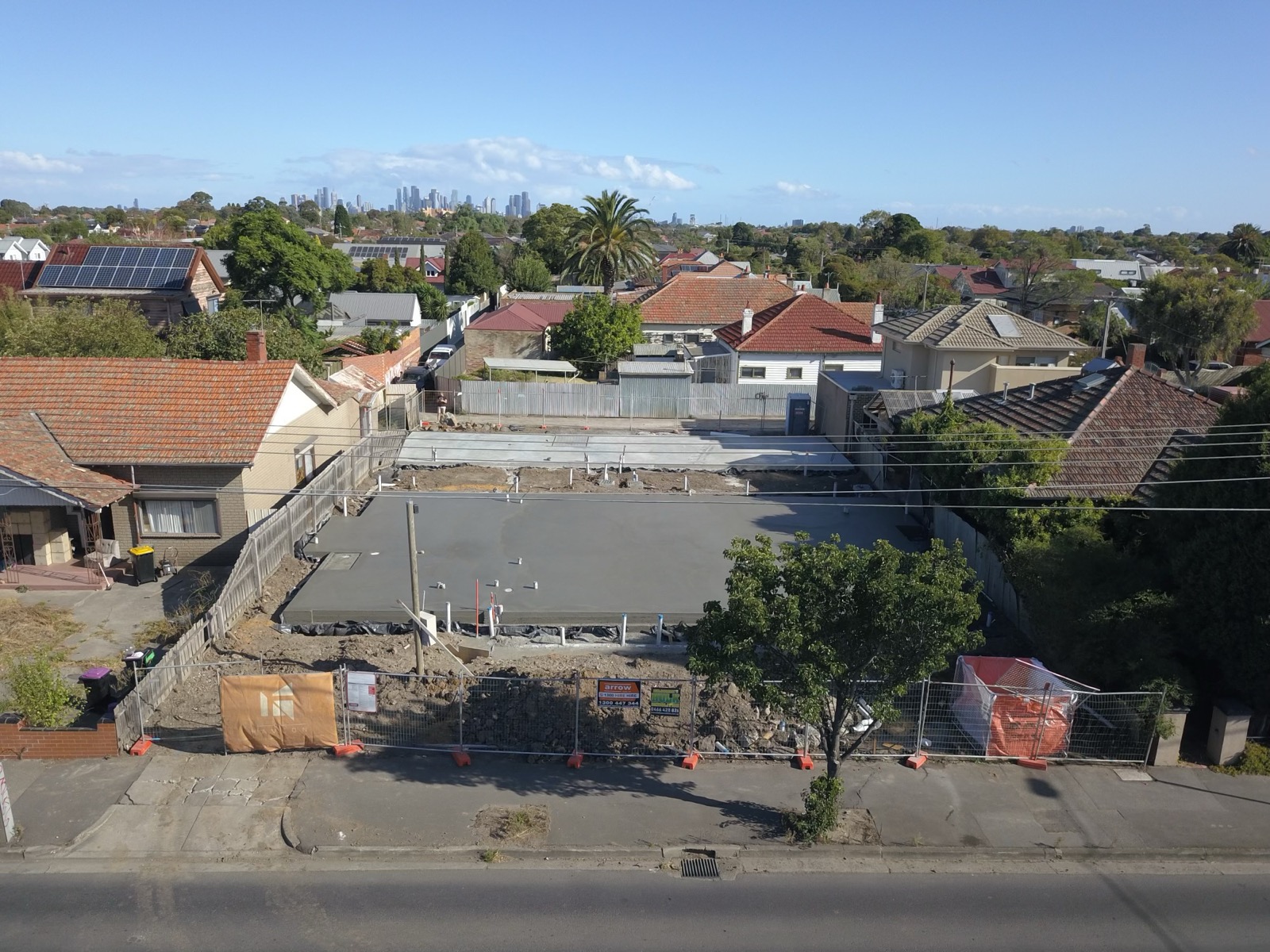 Coburg site, slab poured, Melbourne skyline behind